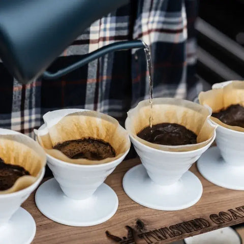 coffee pour overs in a wooden stand