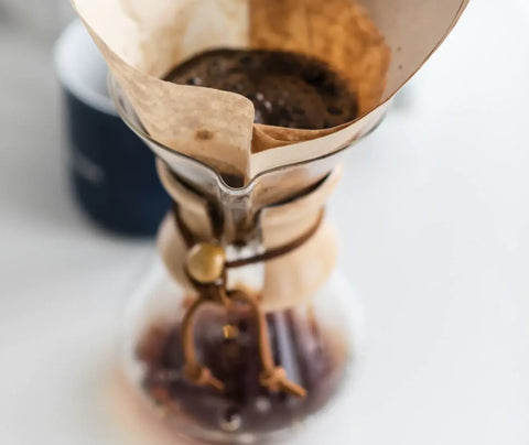 a close up of a chemex coffee maker