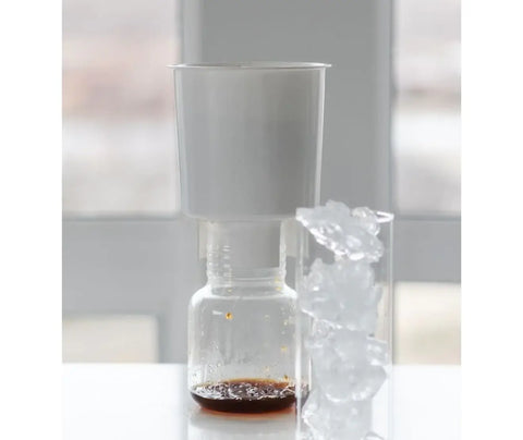 how to make cold brew coffee step 5 filter and drain coffee vessel into container