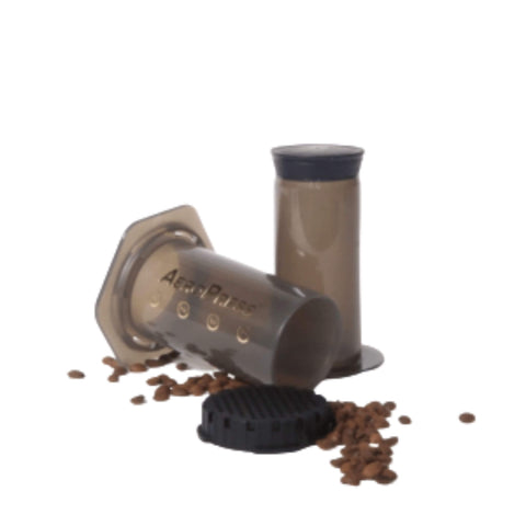 Aeropress Coffee Press Shown With Coffee Beans