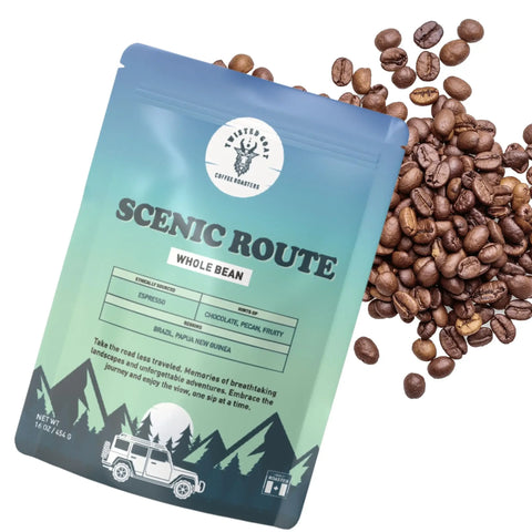 A open bag of Scenic Route espresso with coffee beans spilling out.