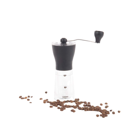 Front View Of A Black Mini Slim Manual Coffee Grinder Shown With Coffee Beans